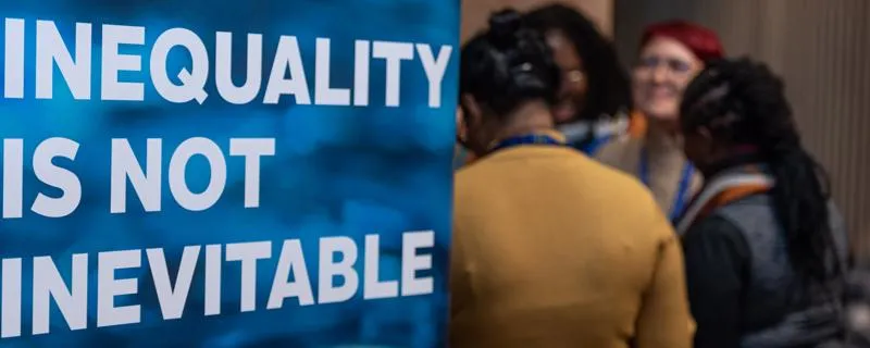 Banner with "inequality is not inevitable" - text