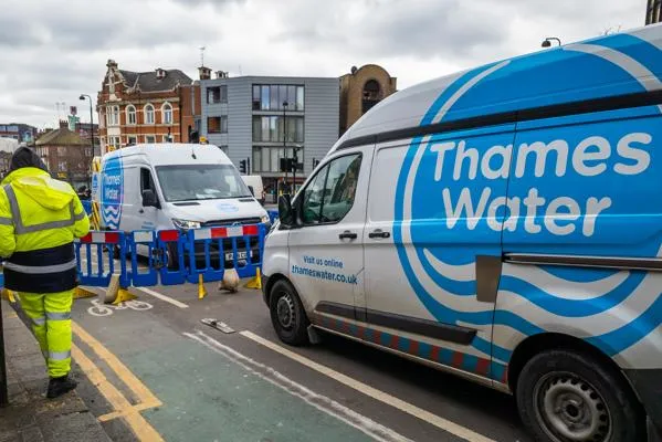 Two Thames Water vans next to a roadwork