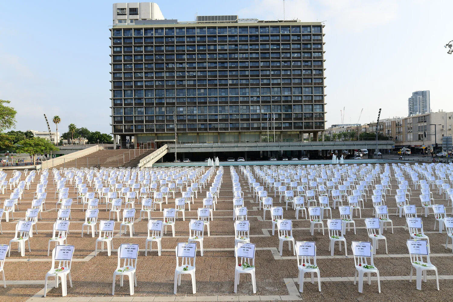 Row upon row of white plastic chairs