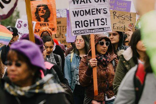 A march with people holding placards