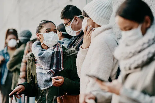 Several people wearing masks