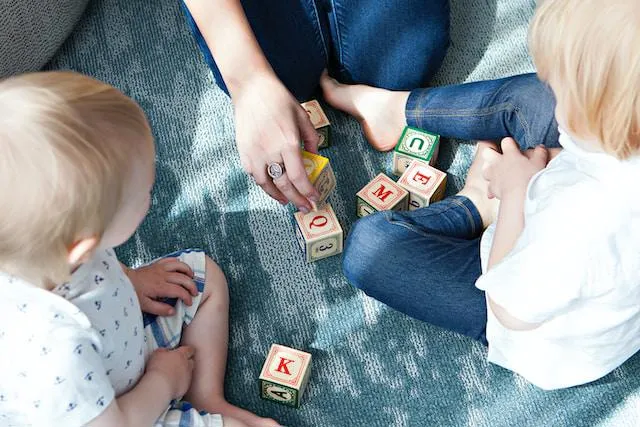 Adult playing with children 