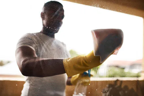 Someone cleaning a window