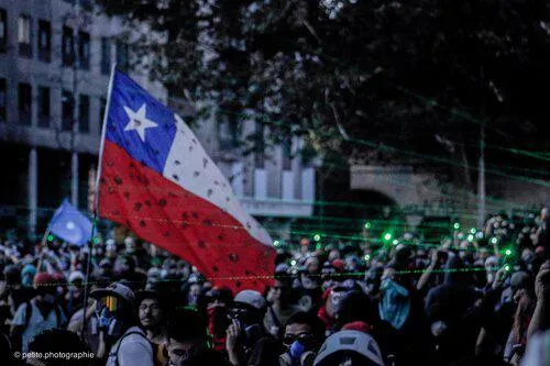 A rally with the Chilean flag held high