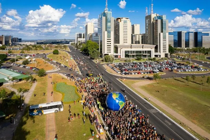 A view from above of a march with hundreds of people