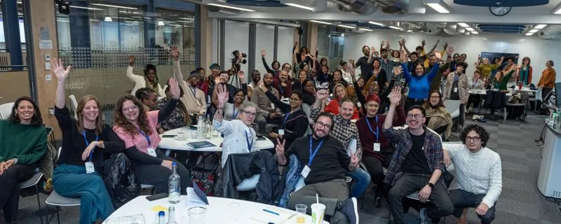 AFSEE Fellows holding their hands up for the photo