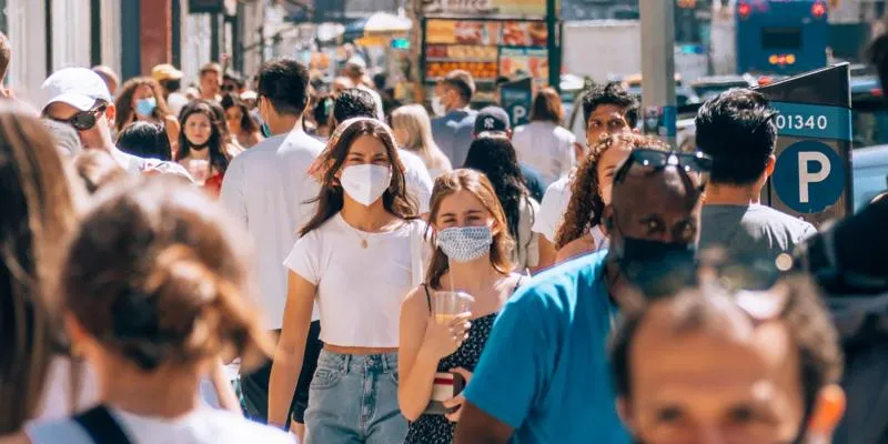 Crowd of people wearing masks